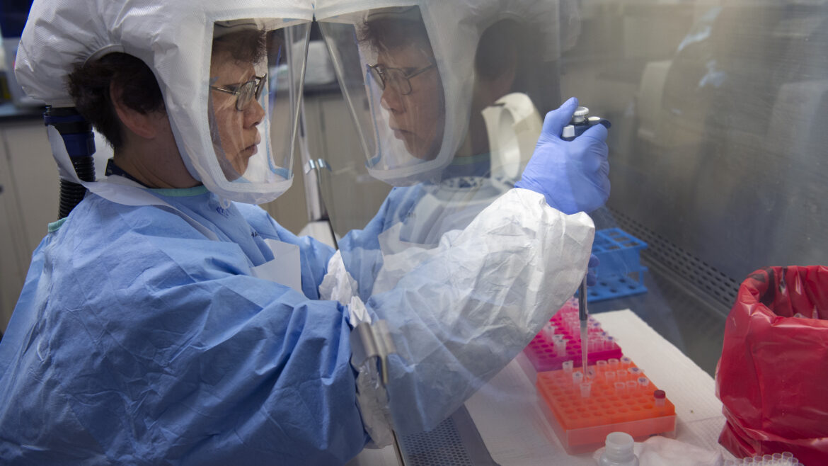Microbiologist Peijia Chen is extracting COVID 19 genetic material from patient samples in the Public Health Laboratory on March 19, 2020. The samples of suspected cases in LA County are tested in the Public Health Lab that meet the criteria. (Photo Credit: Los Angeles County)