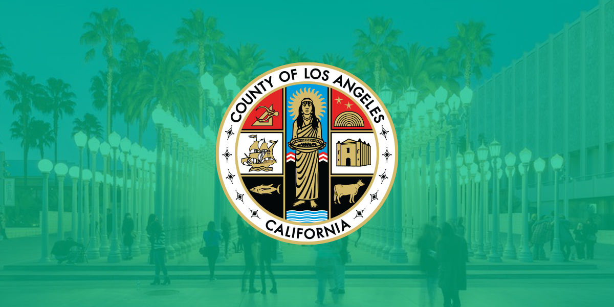 The County seal superimposed on a photo of the Urban Lights exhibit at LACMA